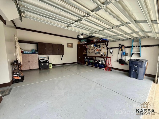 garage with a garage door opener and baseboards