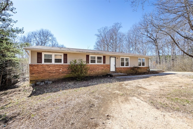 ranch-style home with brick siding and driveway