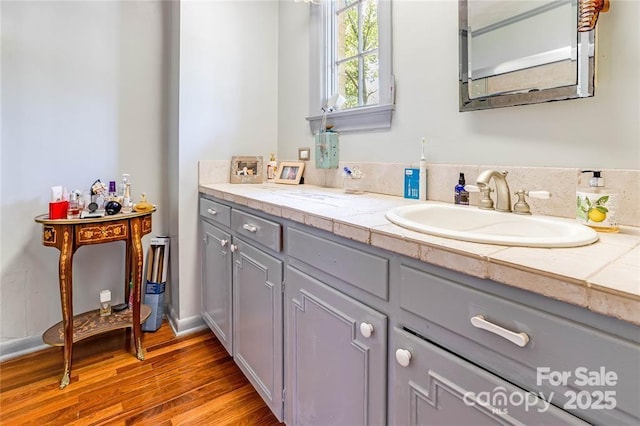 bathroom featuring vanity and wood finished floors