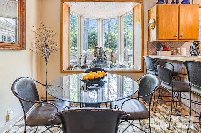 dining room featuring baseboards