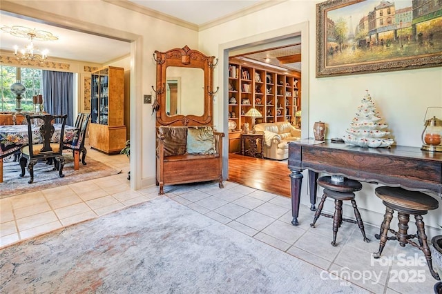 interior space with light tile patterned floors, ornamental molding, and a notable chandelier