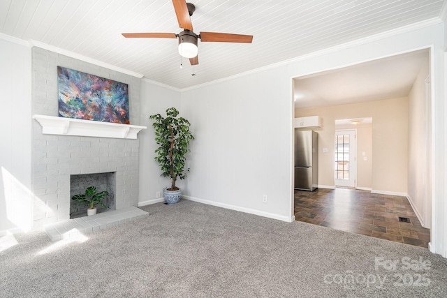 unfurnished living room featuring visible vents, carpet flooring, crown molding, baseboards, and a brick fireplace