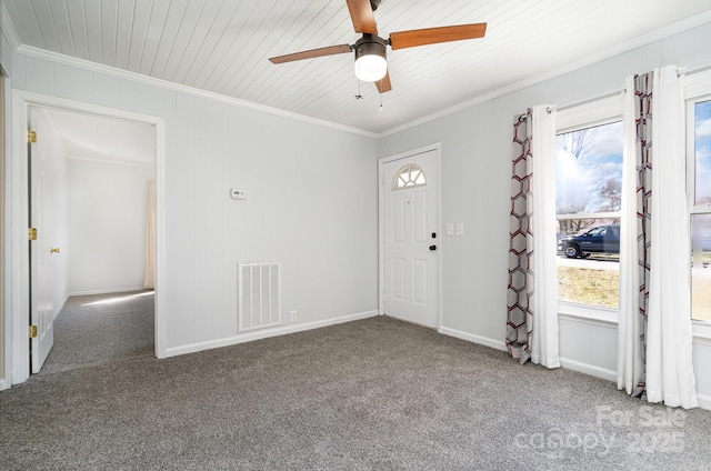 foyer entrance featuring plenty of natural light, visible vents, and ornamental molding