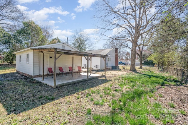 view of yard featuring central AC, a patio, and fence