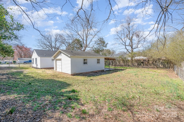 view of yard with an outbuilding and a fenced backyard