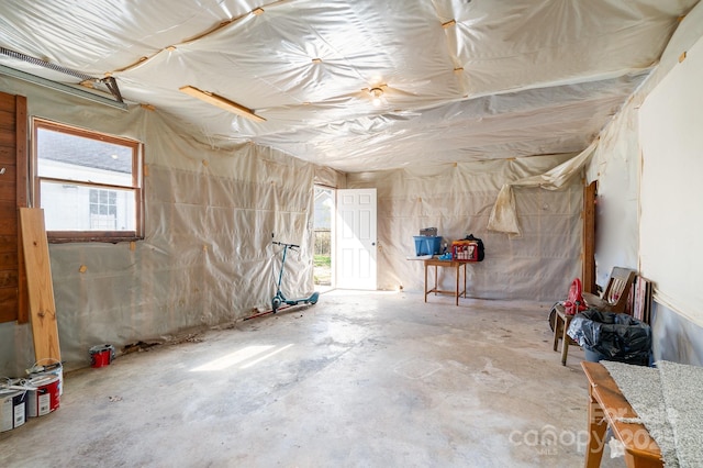 misc room with plenty of natural light and concrete floors