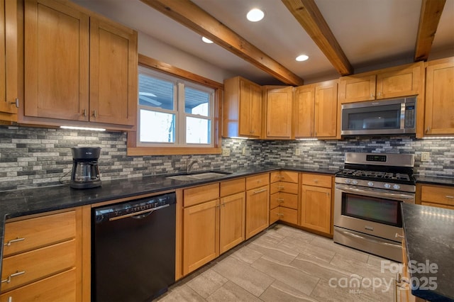 kitchen with decorative backsplash, appliances with stainless steel finishes, a sink, dark stone countertops, and beamed ceiling