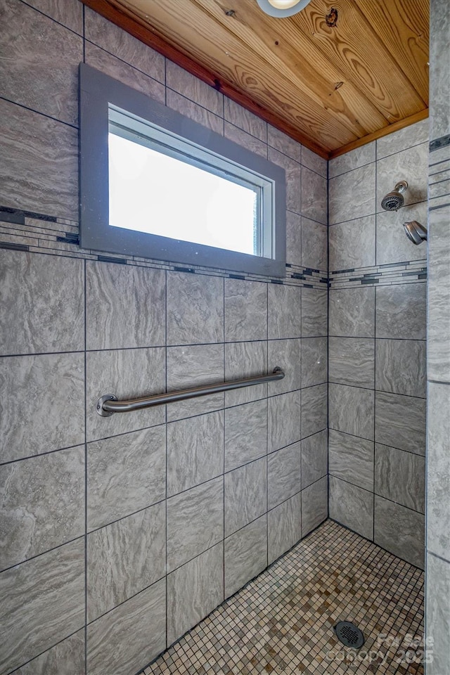 bathroom with tiled shower