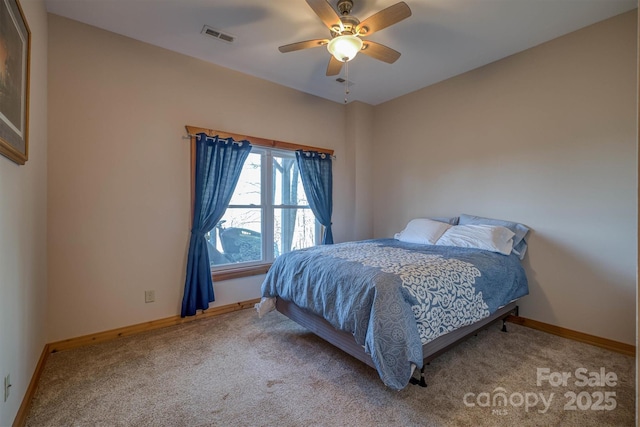 bedroom featuring carpet, baseboards, and ceiling fan