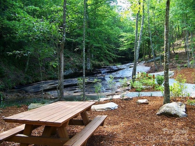 view of property's community with a wooded view