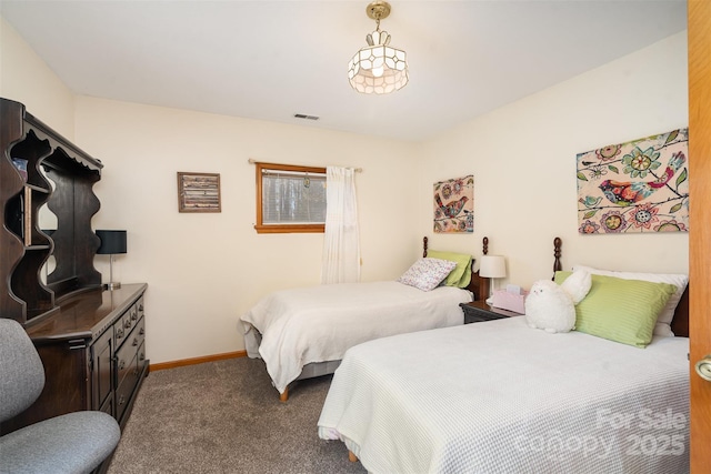 bedroom with carpet floors, visible vents, and baseboards