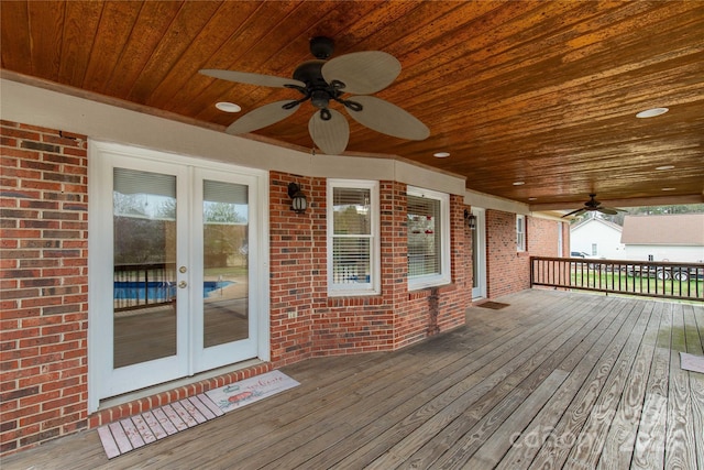 wooden deck featuring french doors and ceiling fan