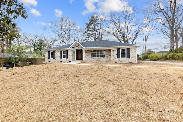 ranch-style home featuring brick siding, crawl space, a chimney, and a shingled roof