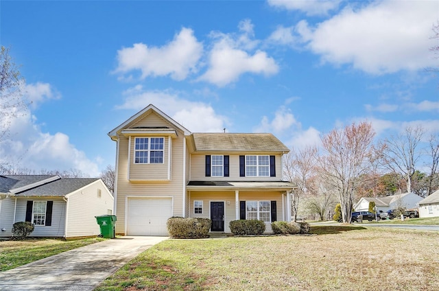 traditional home with a front yard, driveway, and an attached garage