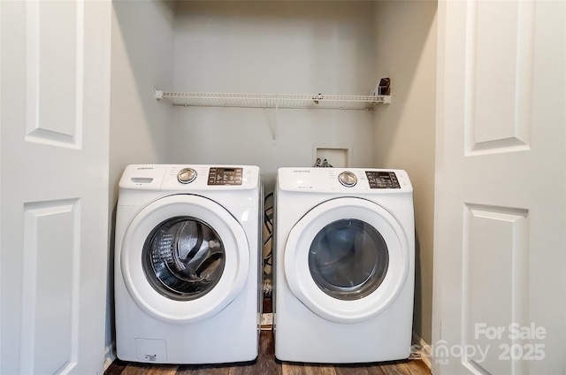 washroom featuring laundry area and washing machine and dryer