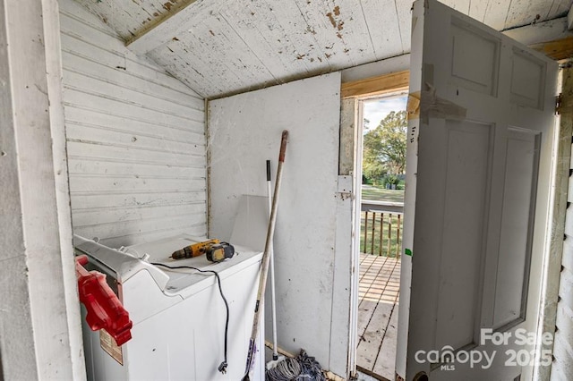 washroom featuring wooden ceiling, laundry area, and washer and dryer