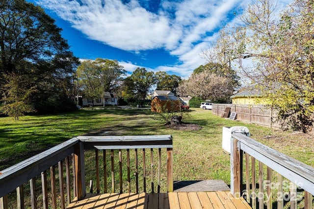 deck with fence and a lawn