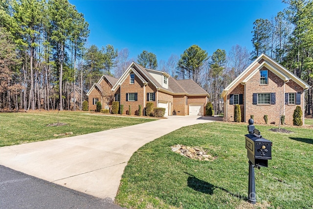 traditional home with driveway, a front lawn, and brick siding