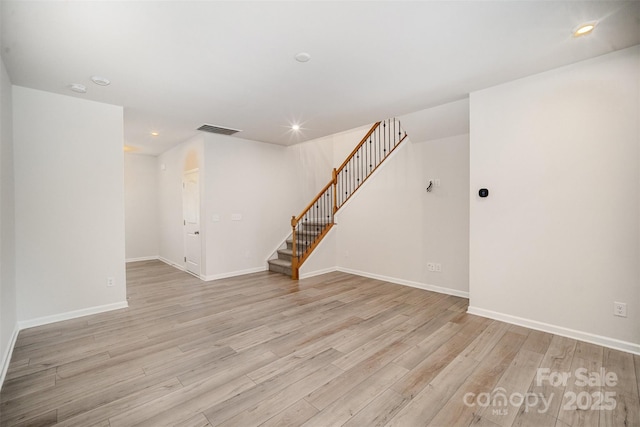 5532 Axil Ln, Charlotte, NC 28269 - empty room featuring stairway, recessed lighting, light wood-style flooring, and baseboards