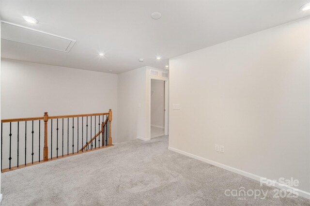 5532 Axil Ln, Charlotte, NC 28269 - spare room with recessed lighting, carpet flooring, visible vents, baseboards, and attic access