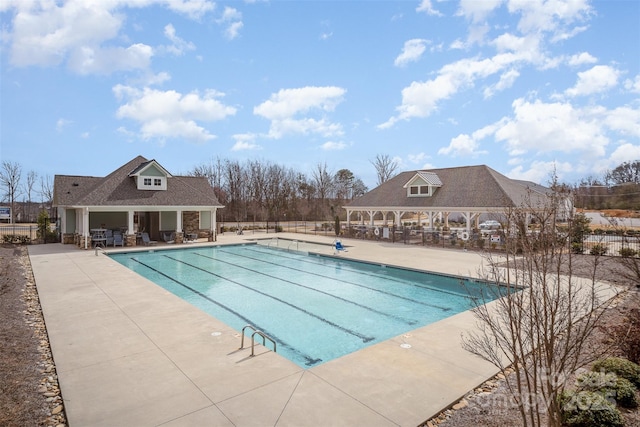 5532 Axil Ln, Charlotte, NC 28269 - pool featuring a gazebo, a patio area, fence, and an outdoor structure