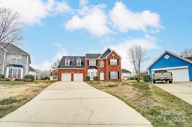 view of front of house featuring brick siding, driveway, a front lawn, and a garage