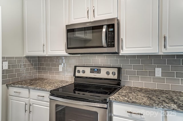 kitchen featuring white cabinetry, tasteful backsplash, and appliances with stainless steel finishes