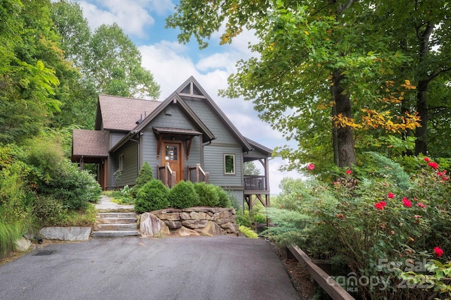 view of front of home featuring roof with shingles