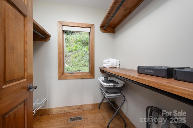 interior space featuring visible vents and wood finished floors