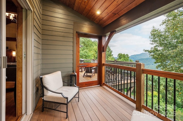 wooden deck featuring a mountain view