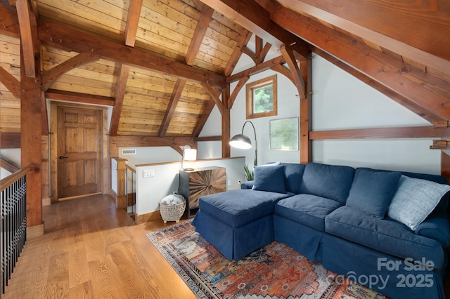 living room featuring wooden ceiling, vaulted ceiling with beams, visible vents, and light wood finished floors