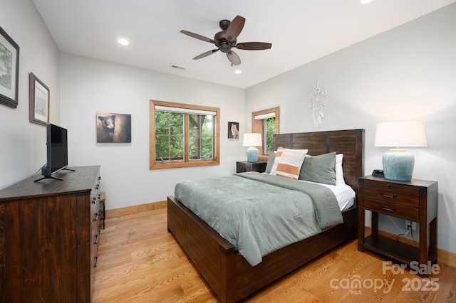 bedroom with recessed lighting, light wood-type flooring, baseboards, and visible vents