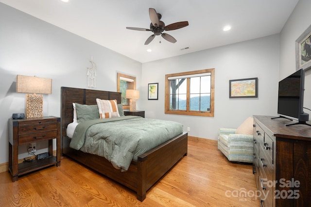 bedroom with recessed lighting, light wood-style flooring, a ceiling fan, and visible vents