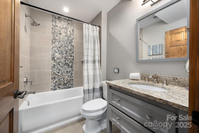 bathroom with tile patterned floors, toilet, vanity, and shower / tub combo with curtain