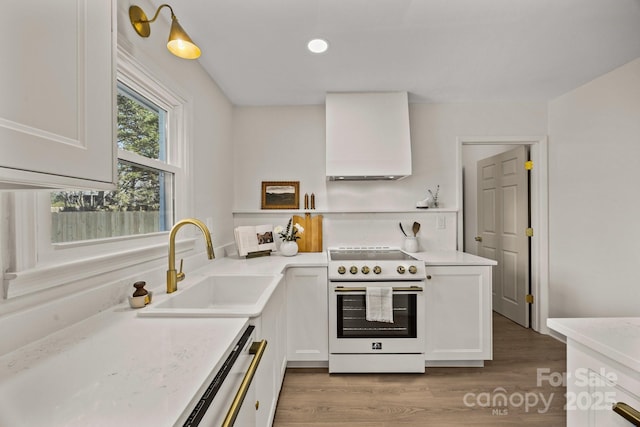 kitchen with white cabinets, white electric range, a sink, and dishwasher