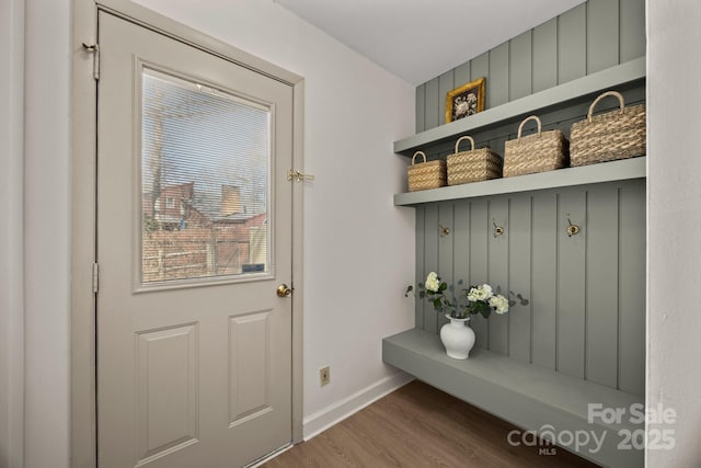 mudroom featuring baseboards and wood finished floors