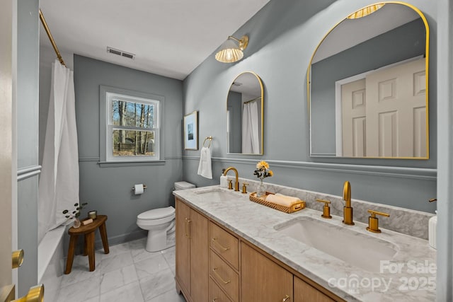 bathroom with marble finish floor, visible vents, a sink, and toilet