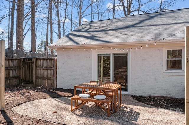 view of patio featuring fence