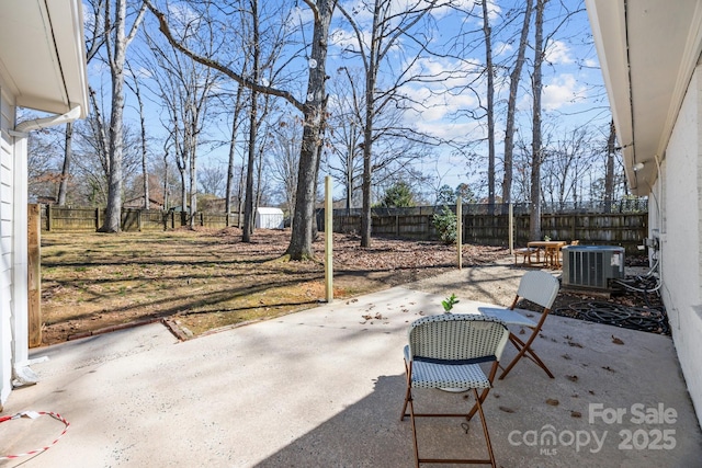 view of patio with cooling unit and a fenced backyard