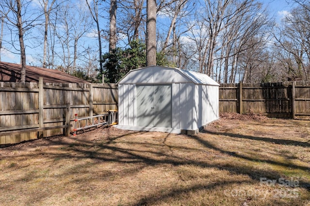 view of shed with a fenced backyard