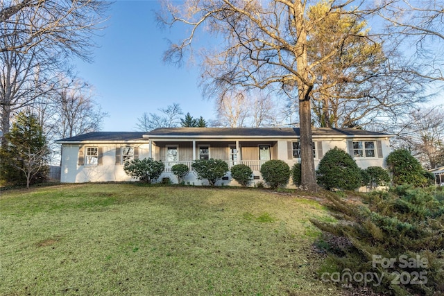 single story home featuring a front lawn and a porch