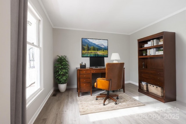 home office featuring wood finished floors, crown molding, and baseboards