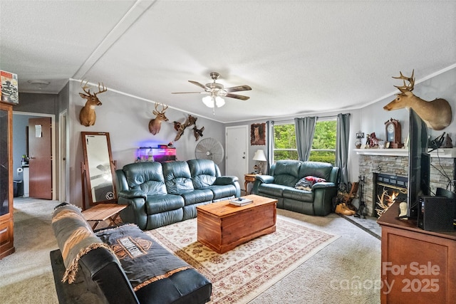 carpeted living room with a fireplace, a ceiling fan, and a textured ceiling