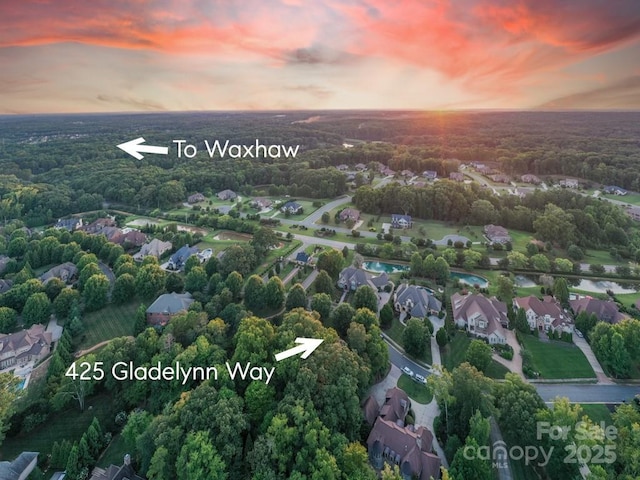 birds eye view of property with a residential view