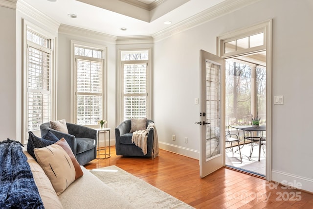 living area with recessed lighting, baseboards, french doors, wood-type flooring, and crown molding