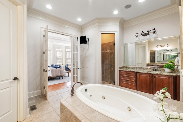 full bathroom with ornamental molding, french doors, a shower stall, and ensuite bathroom