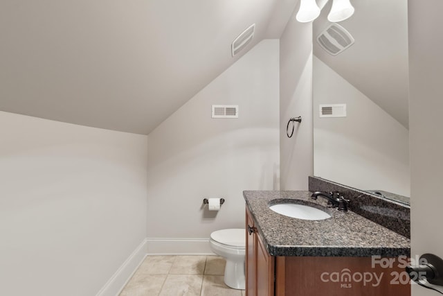 half bathroom with toilet, vanity, and visible vents