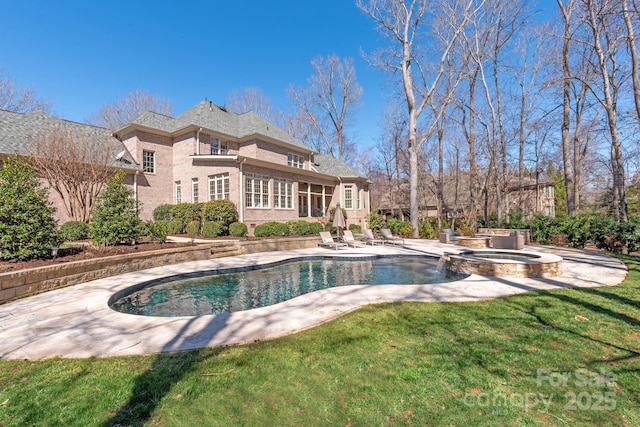 view of pool with a pool with connected hot tub, a lawn, and a patio