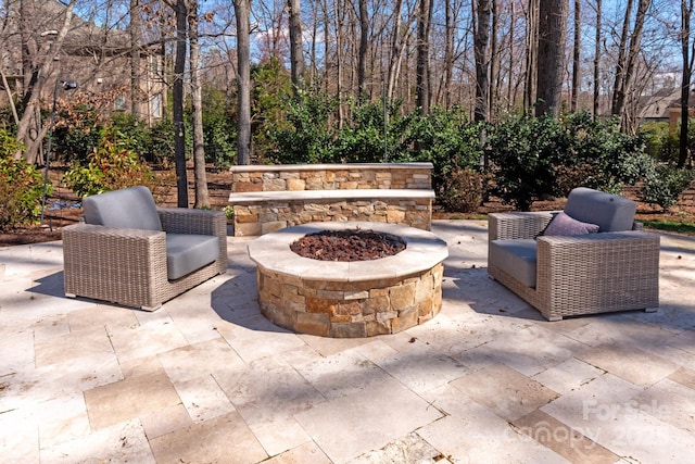 view of patio featuring a fire pit