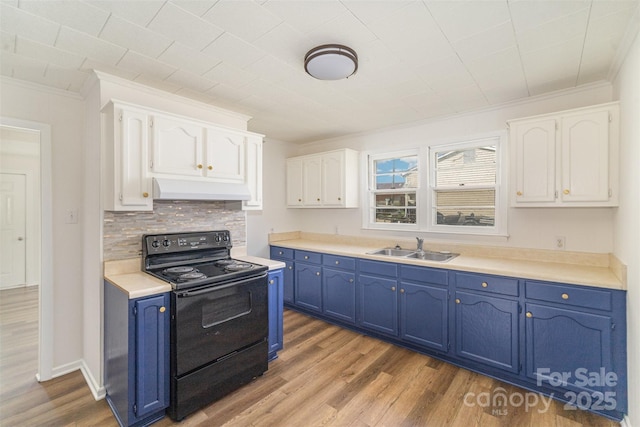 kitchen with a sink, blue cabinetry, white cabinets, and black range with electric stovetop